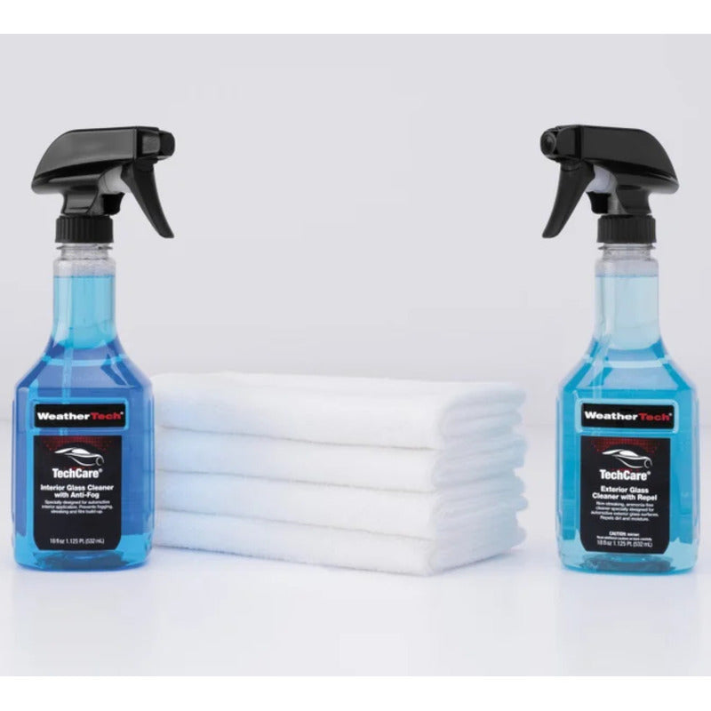 Two bottles of WeatherTech car glass cleaner with cloths on a white background