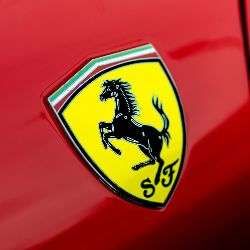 Ferrari logo on a red background